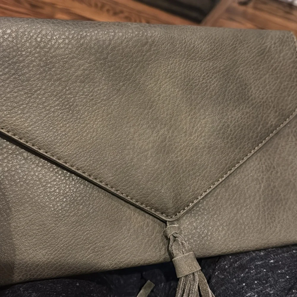 Anthropologie Street Level faux pebbled leather olive tasseled envelope clutch.